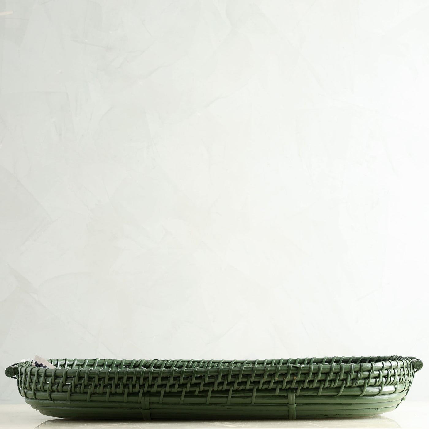 HEIRLOOM NAGA oval basket durable cane in an earthy green hue 