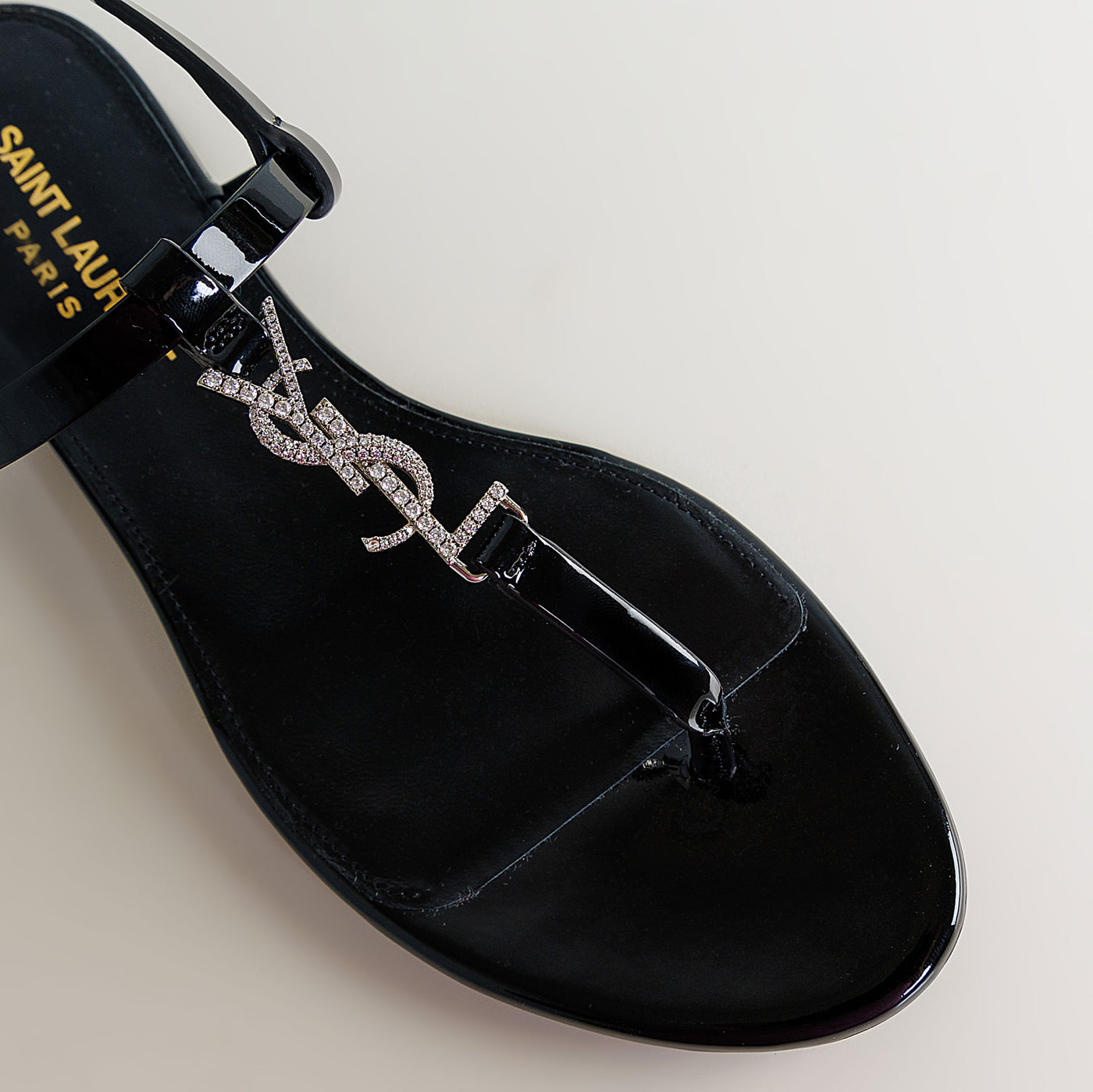 SAINT LAURENT black cassandre flat sandals