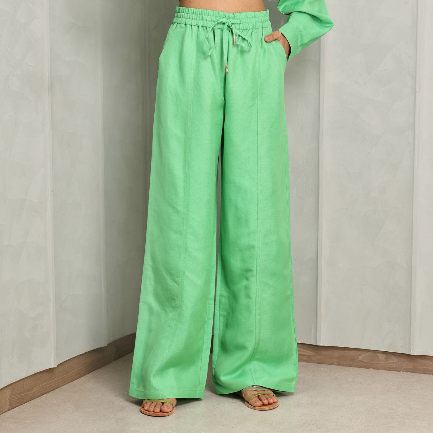 ACLER bonython pants green elastic waist band, adjustable drawstring and inseam pockets, this pant adorns a fitted waist silhouette flare at the hem