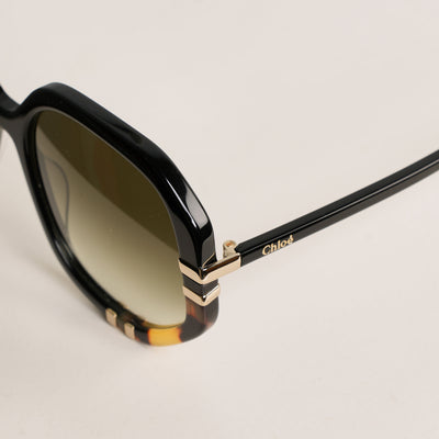 Chloé West Sunglasses  feature a black and Havana frame combined with gradient green lenses, sophisticated metal inserts.