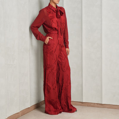 Red textured pants by Elie Saab