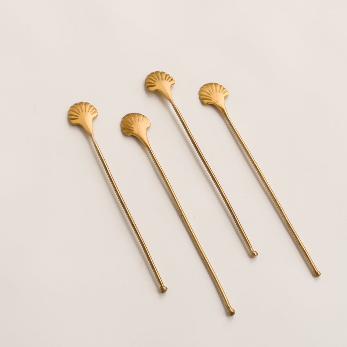 shell shaped golden color stirrers 