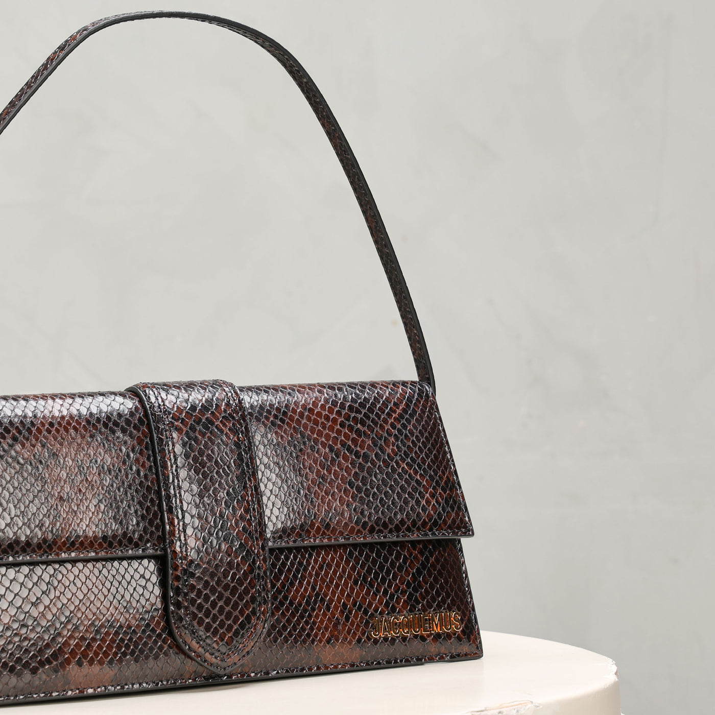 brown and black snake skin printed long bombino shoulder bag 