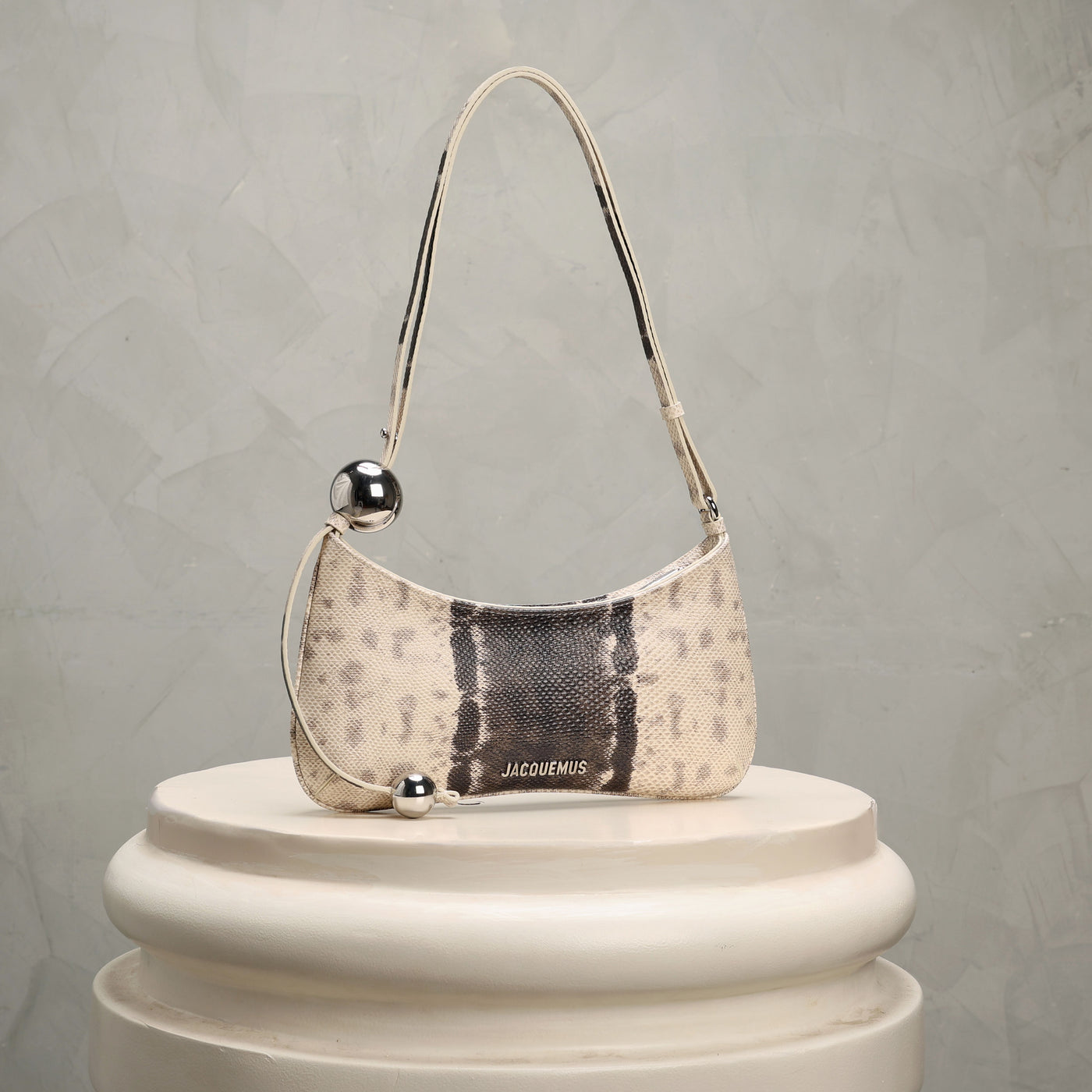 Jacqquemus shoulder bag with snake print and metallic accents 