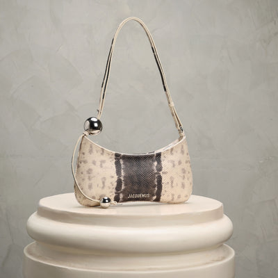 Jacqquemus shoulder bag with snake print and metallic accents 