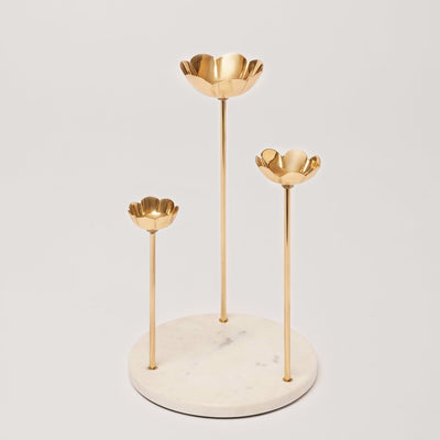 Candle holder of golden color  