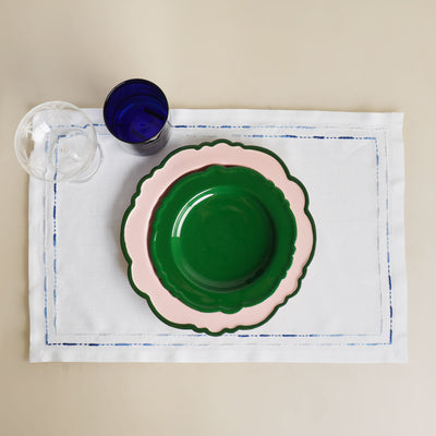 green and pink ceramic plates