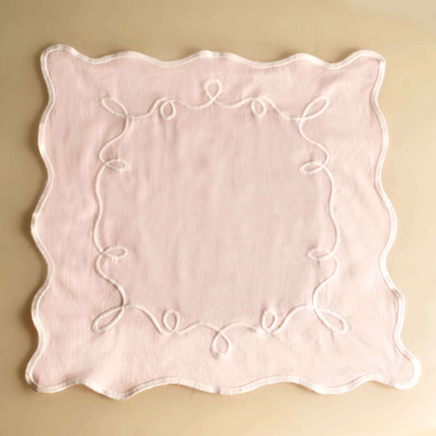 pink embroidered carnival mapkin
