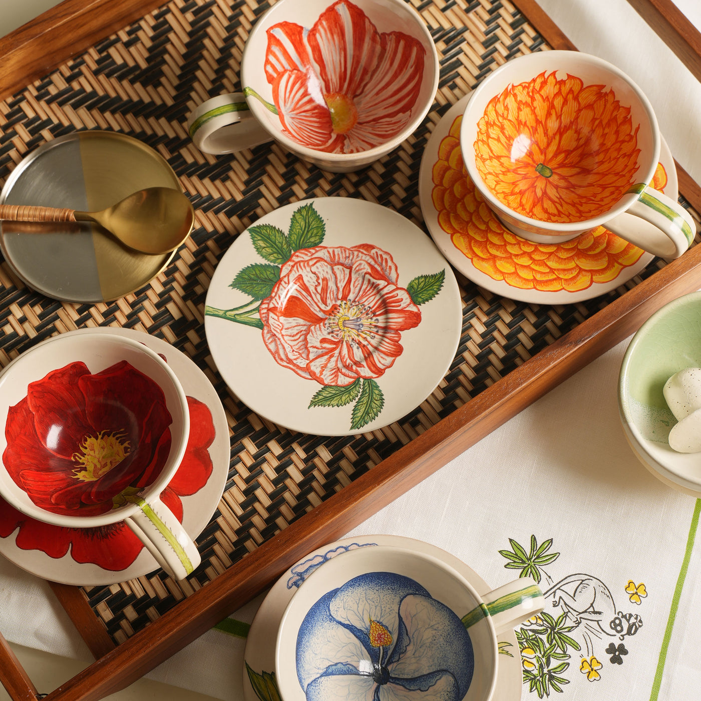 KHANOOM tea cup and saucer marigold vibrant marigold motif with timeless white backdrop