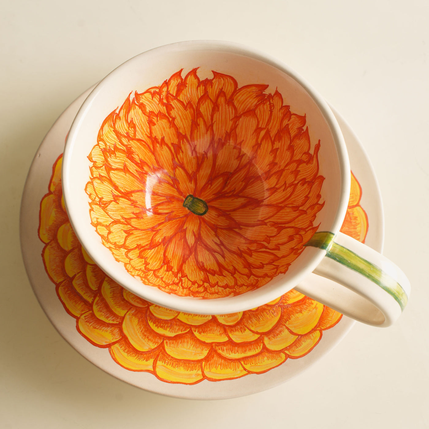 KHANOOM tea cup and saucer marigold vibrant marigold motif with timeless white backdrop