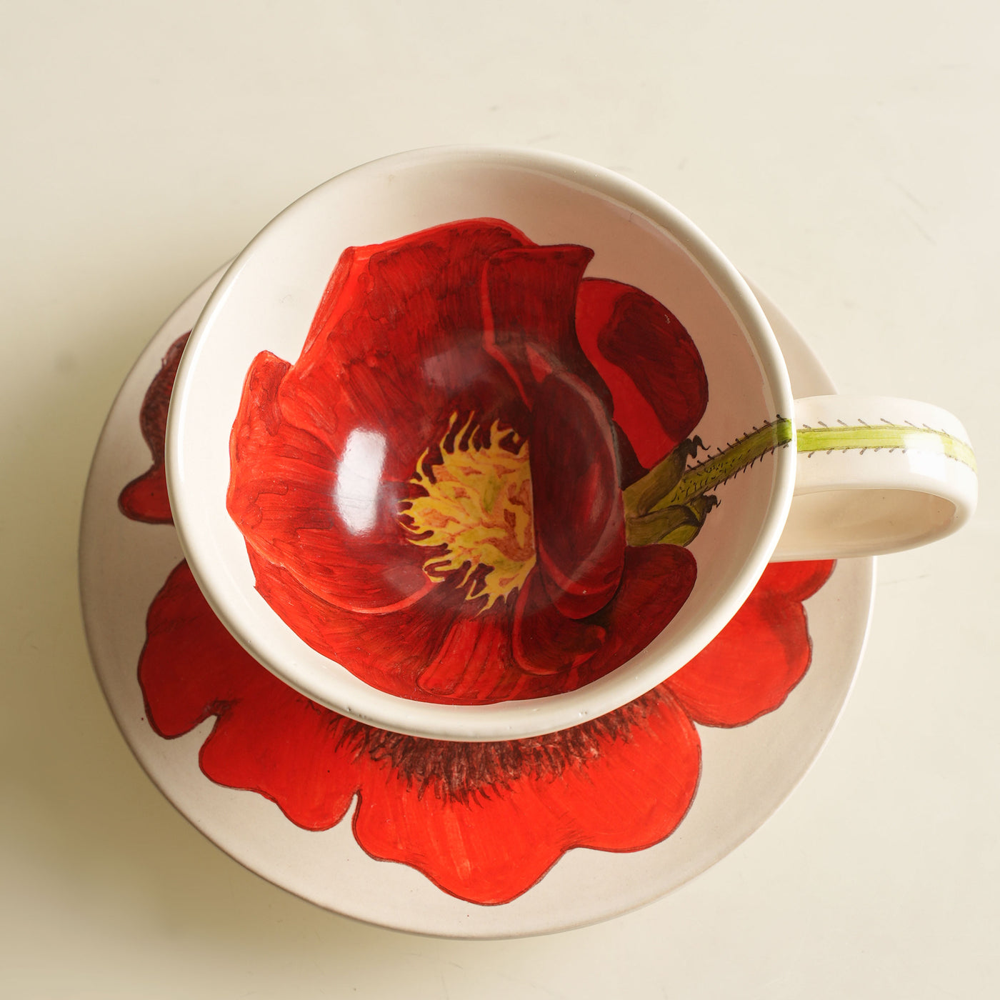 KHANOOM tea cup and saucer rose deep red rose motifs with classic white backdrop