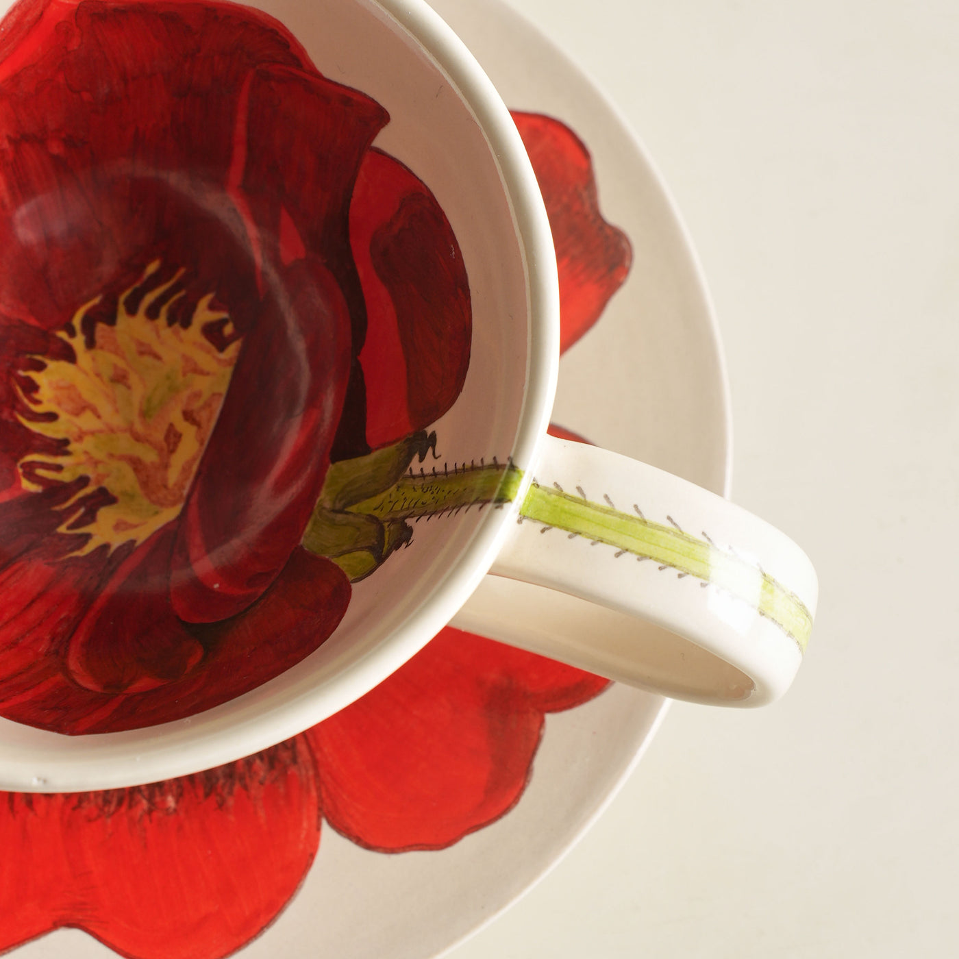 KHANOOM tea cup and saucer rose deep red rose motifs with classic white backdrop