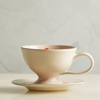 KHANOOM tea cup and saucer tulip graceful tulip motif with soft white backdrop