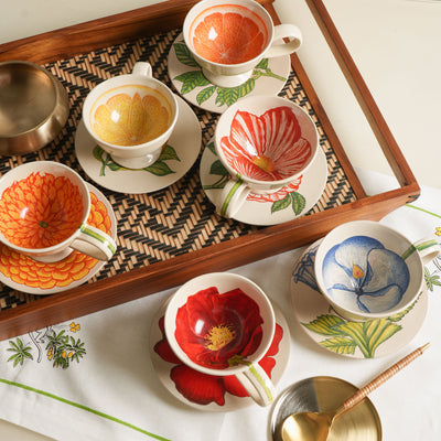 KHANOOM tea cup and saucer blue hibiscus hibiscus motif with white backdrop