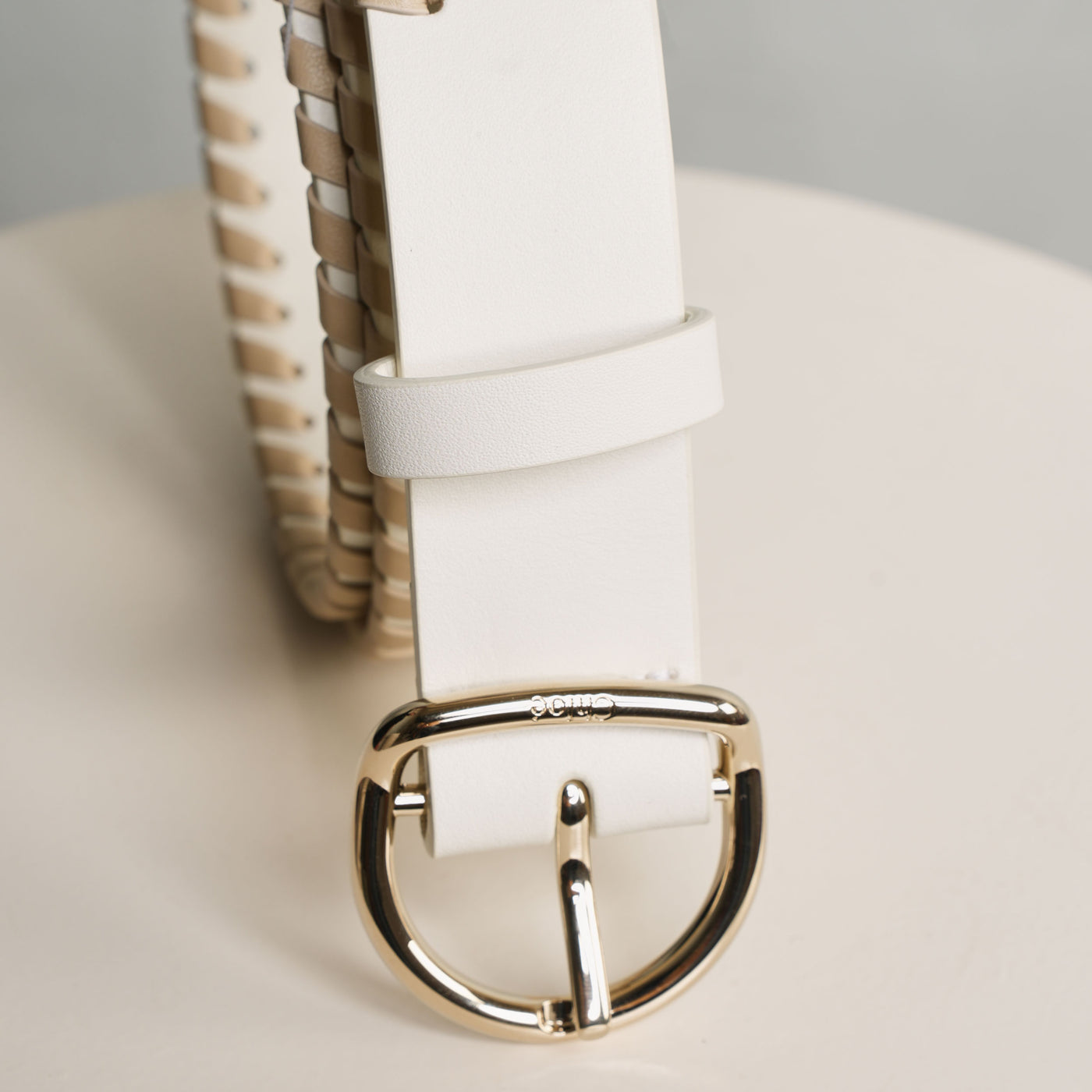 Chloé Mony Belt features beige-hued decorative whipstitching and a gold-toned buckle.