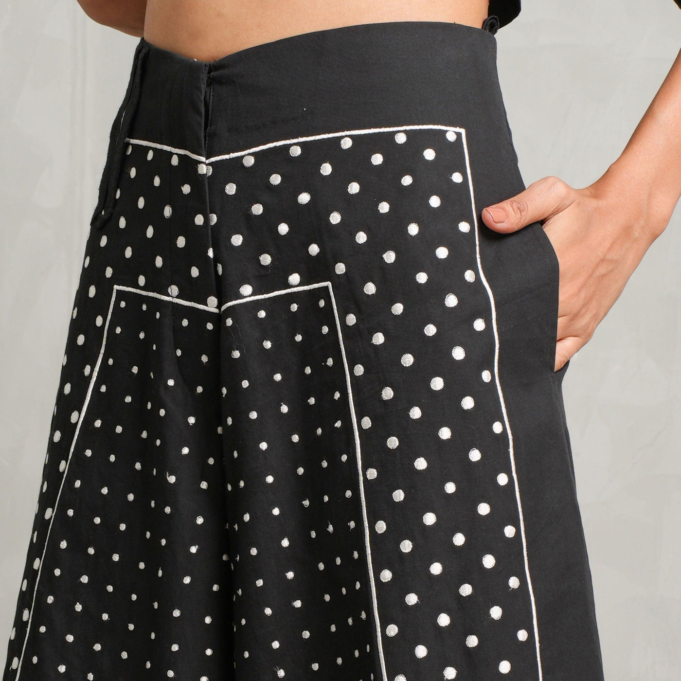 Leh Studios A-line Cropped Pants  feature a cropped hem, a wide-legged silhouette, a high waist, side pockets, and a zip and button closure.