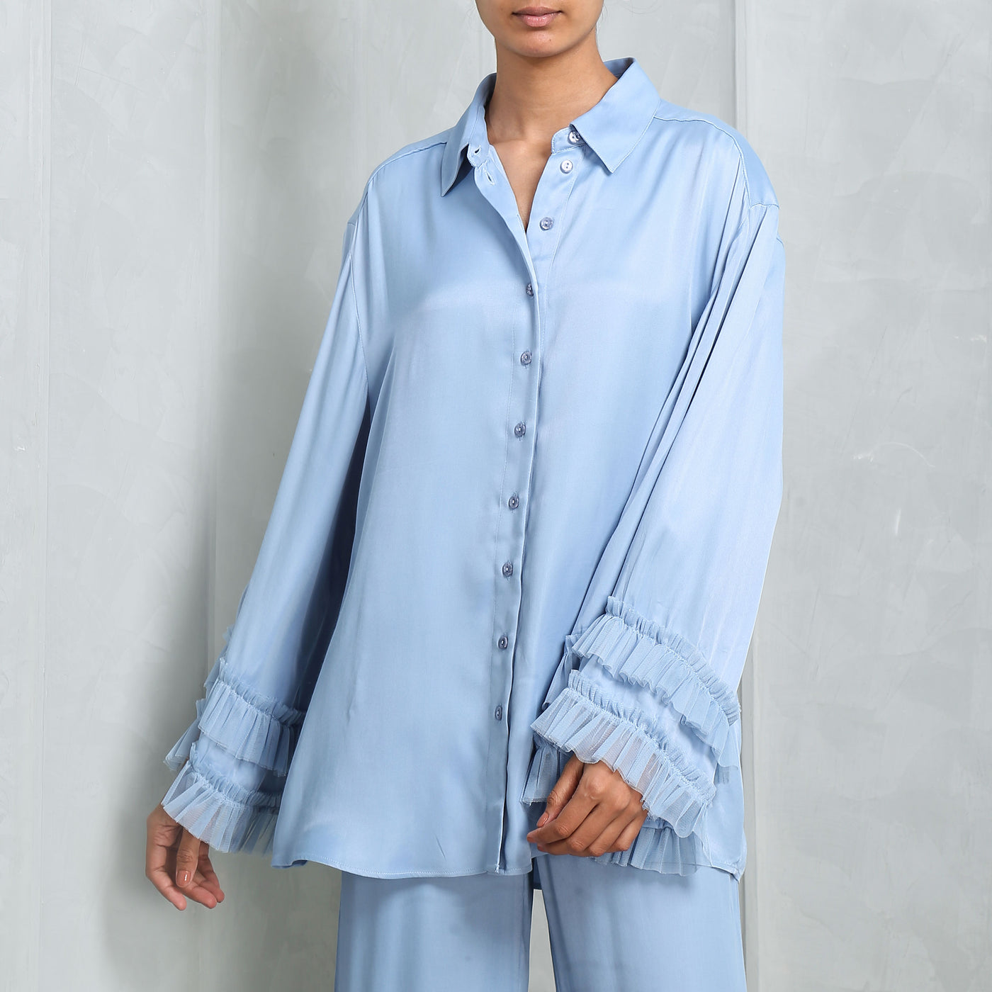 Malie Santos Ruffle-trimmed Shirt with ruffled trims at the cuffs.