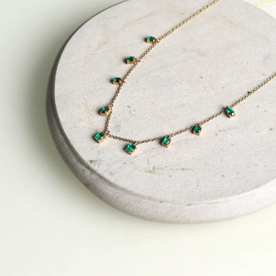 Emerald Fringe Necklace from the Line on a yellow gold chain 
