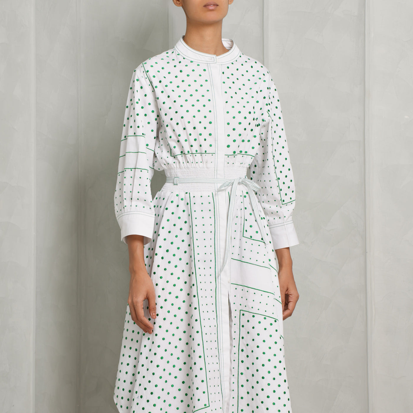 Leh Studios Hankerchief Midi Dress with  long sleeves with buttoned cuffs, inseam pockets and a concealed front button placket.
